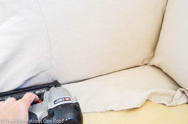 Pottery Barn slipcover used to reupholster a couch with staple gun and staples