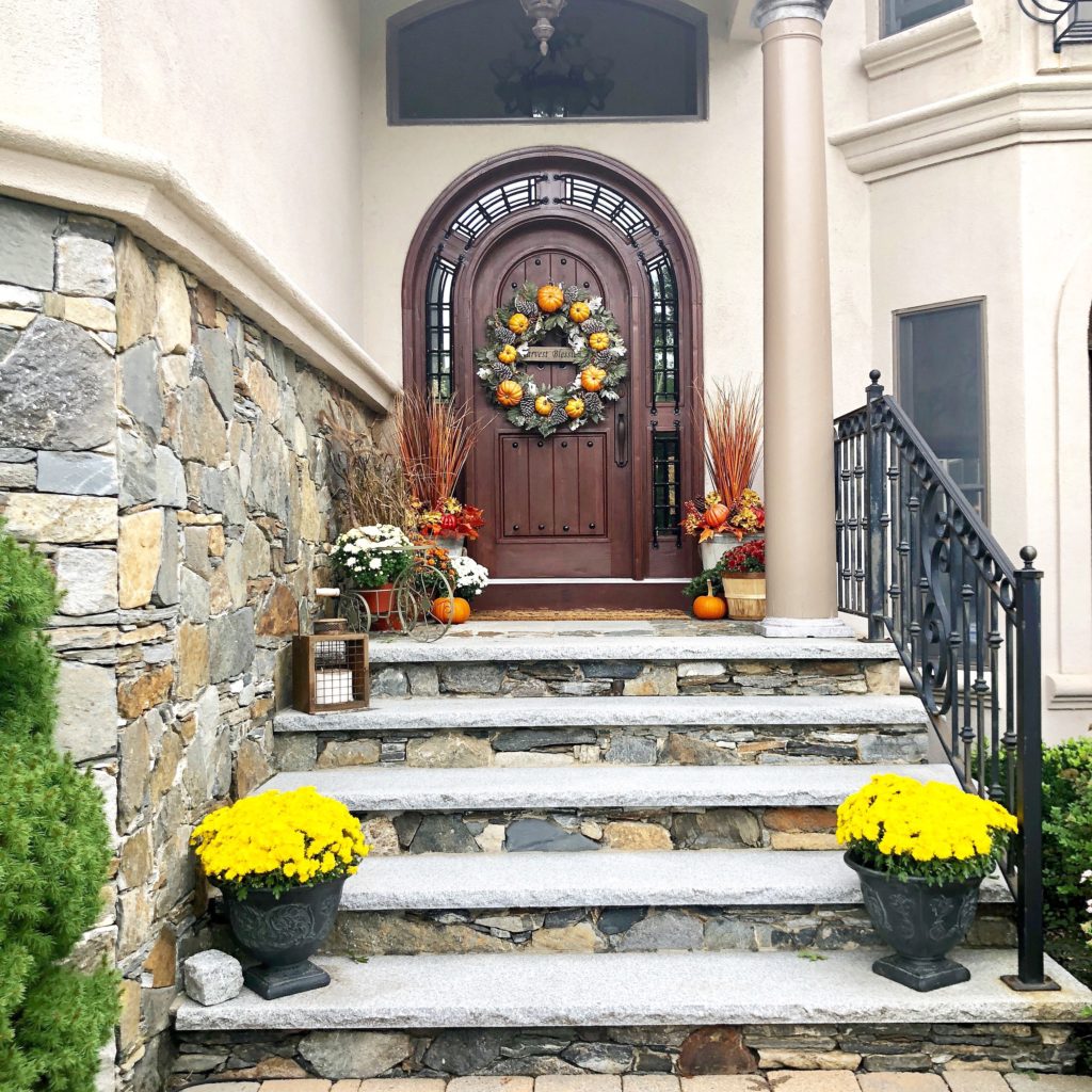 Simple Rustic Modern Fall Decor {Our Mediterranean Home Fall Tour} Grand Stained Front Door | Stone front entrance | Fall wreath |Fall decor |Curb Appeal | Flower Planters