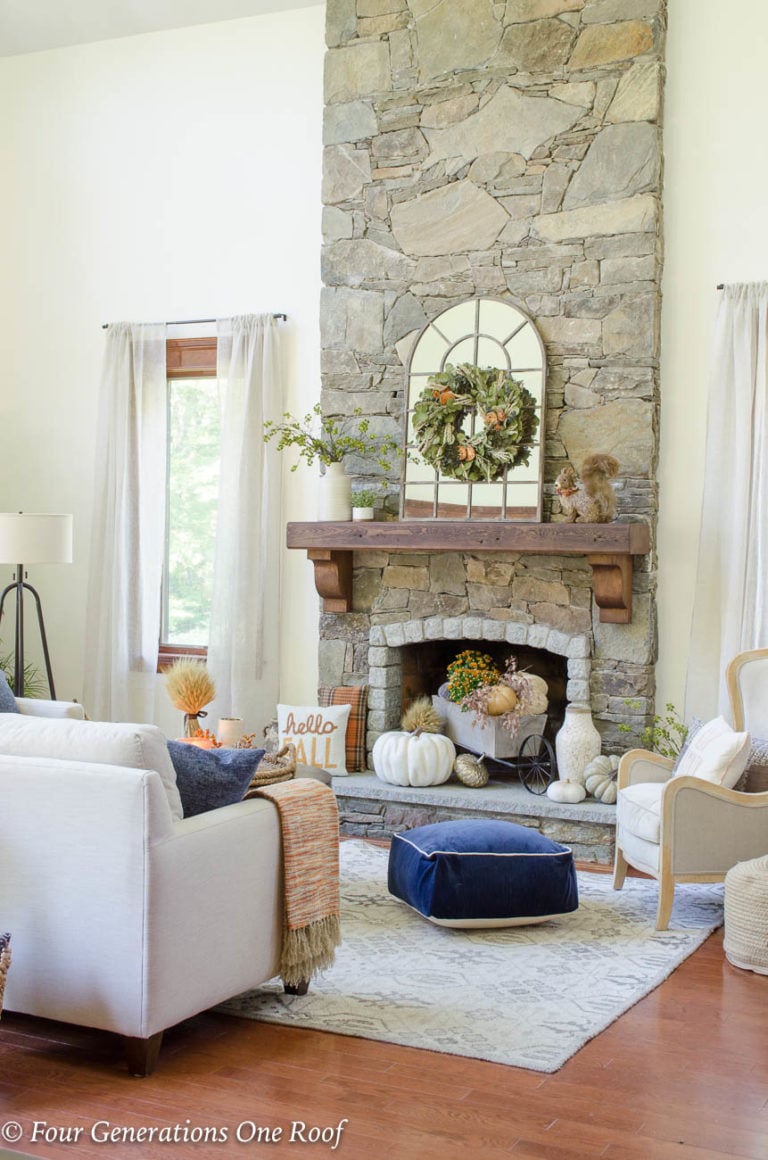 Simple Rustic Modern Fall Decor {Our Mediterranean Home Fall Tour} Neutral colored pumpkins, greenery, fall pillows and dried flowers #falldecor #rustic #modern #rusticmodern #livingroom #kitchen #diningroom #openconcept #bhg #gofinding #hgtv #sectional #diningtable #slipcoveredchair