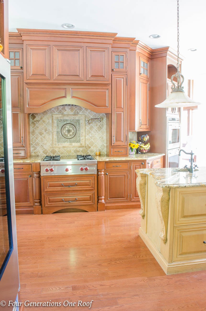 mediterranean kitchen with dark cherry cabinets