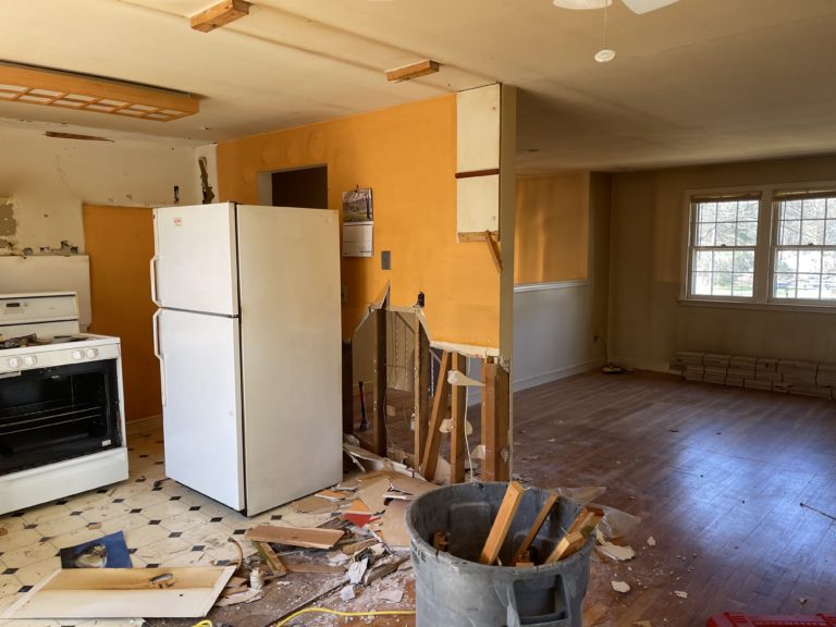 tearing down a kitchen wall in a split level home