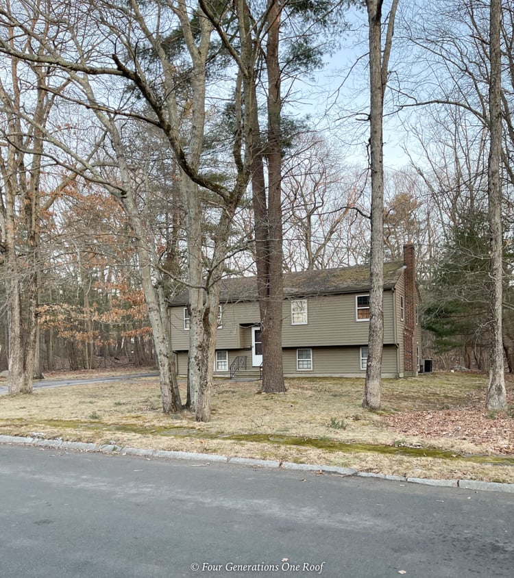 1970s split level with old trees in front yard