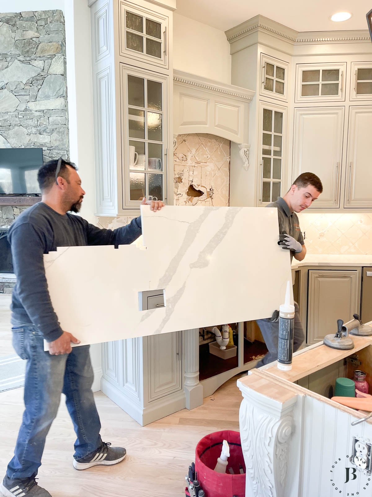 quartz backsplash installation in a kitchen