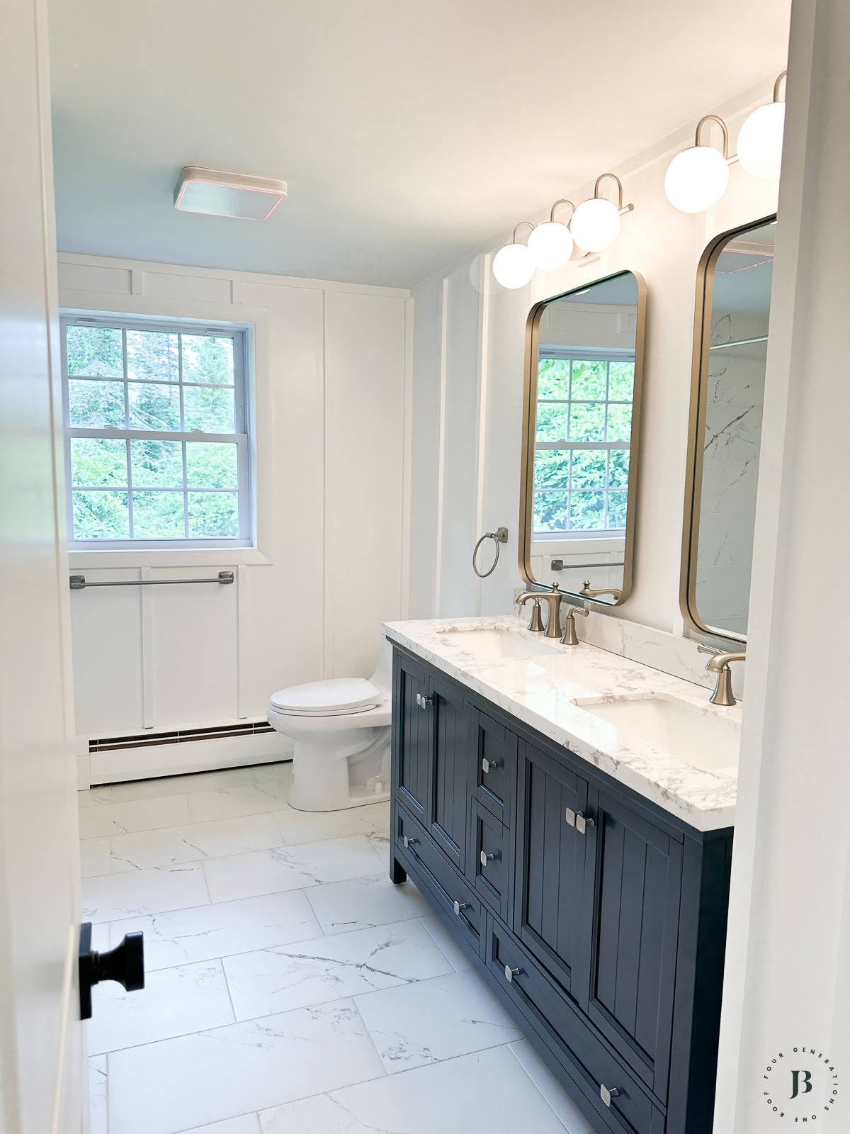 pure white white paint interior walls in a bathroom with a navy vanity