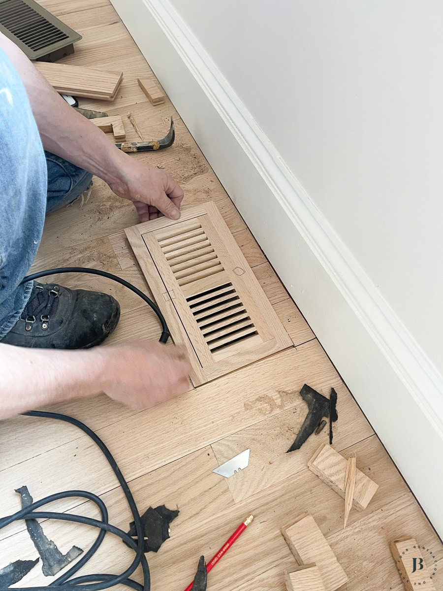 installed wood floor vent cover flush with refinished red oak floor seamless transition
