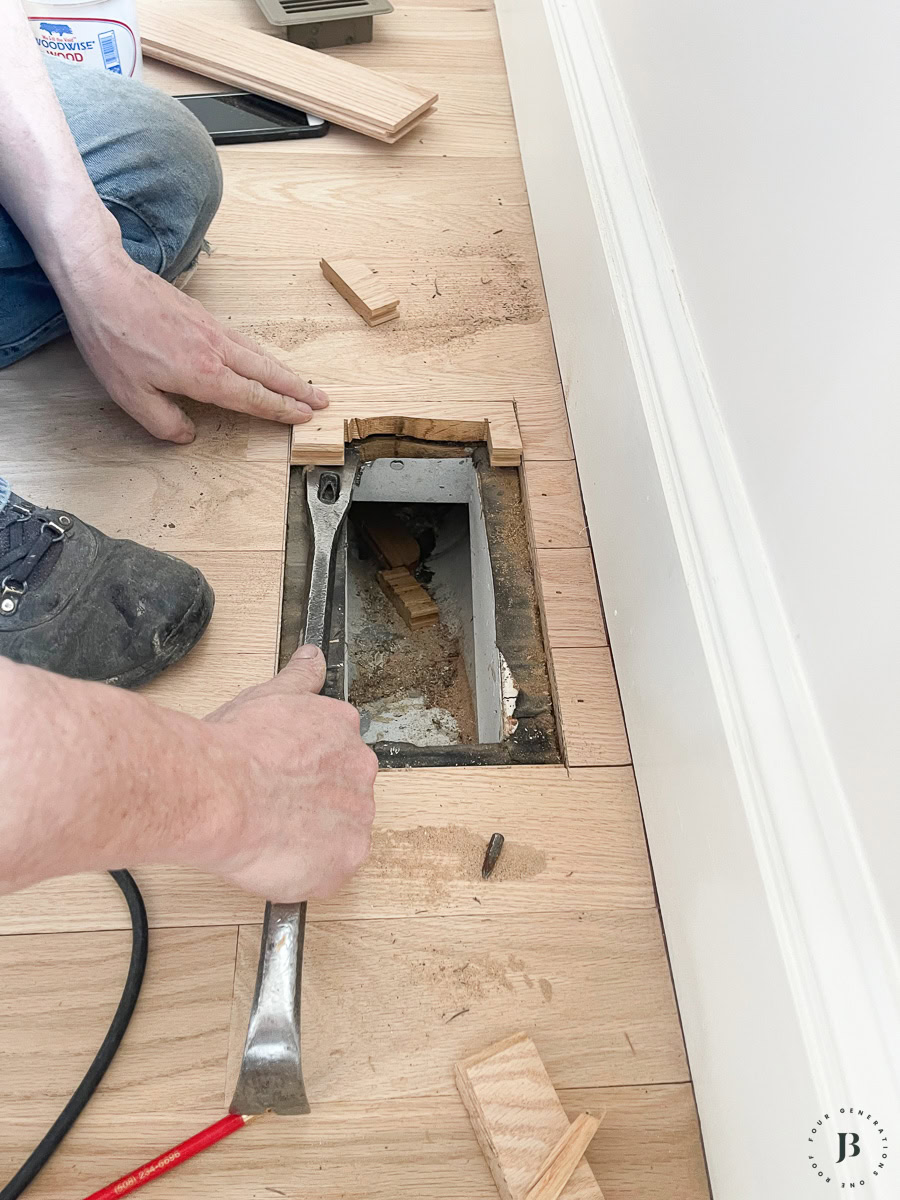using multitool to cut recessed frame for wood floor vent installation