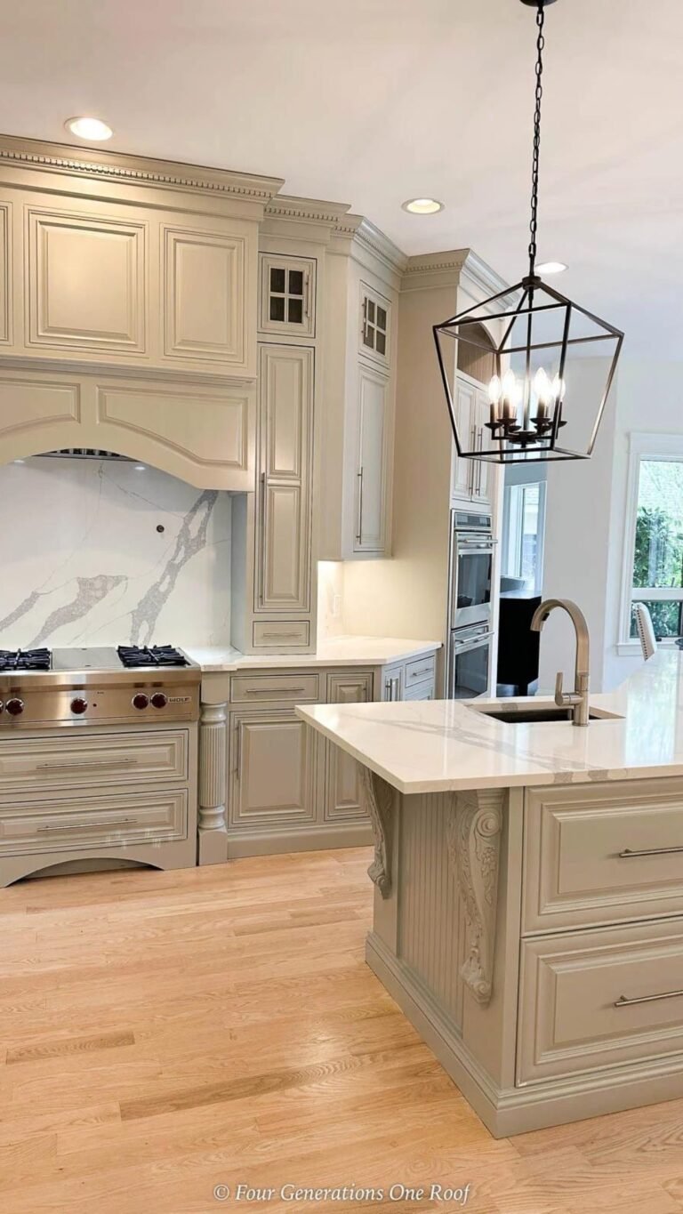 sherwin williams mindful gray painted kitchen cabinets in artificial lighting