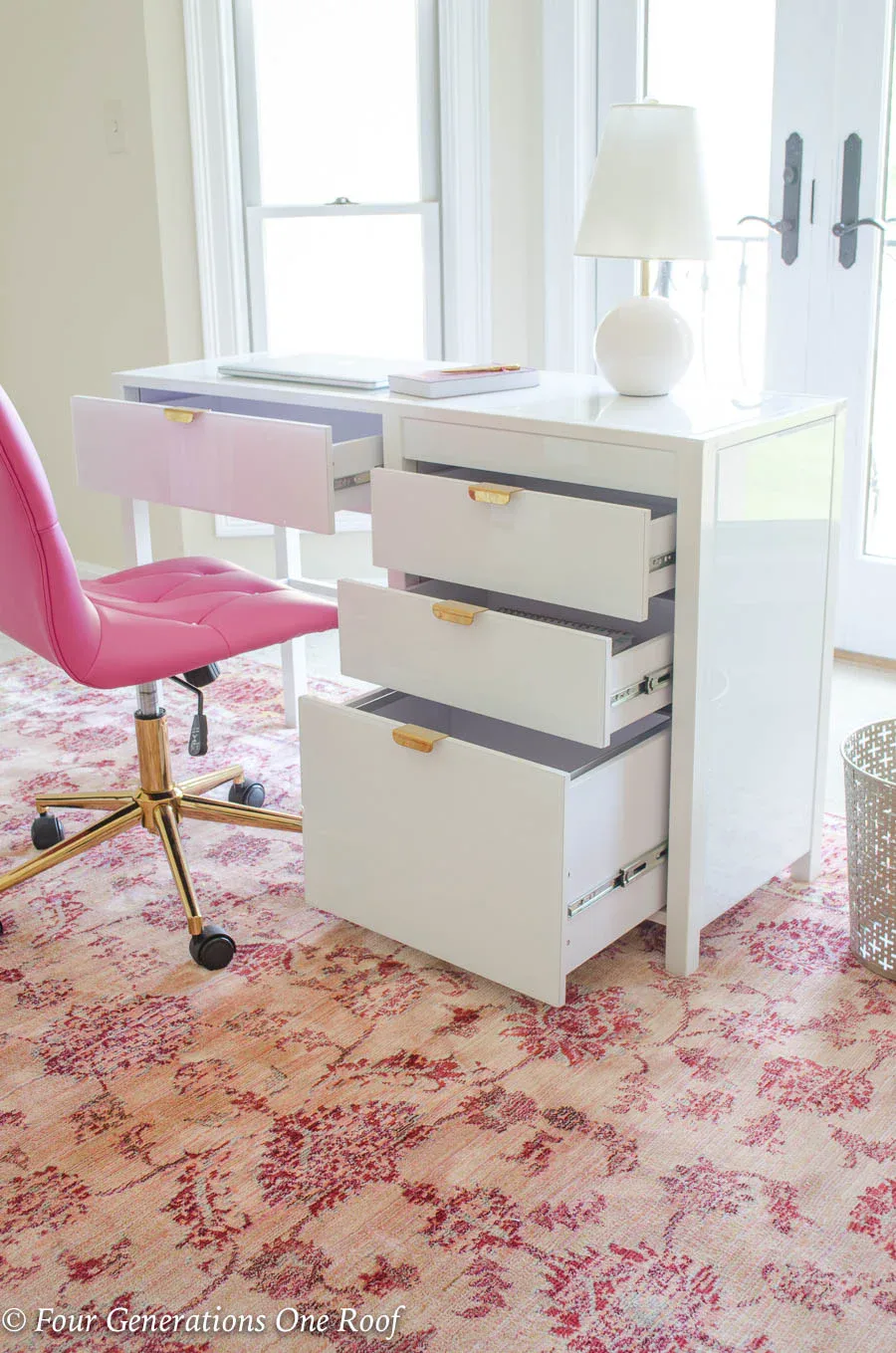 Close up of white and gold desk drawer with built-in filing system for office organization