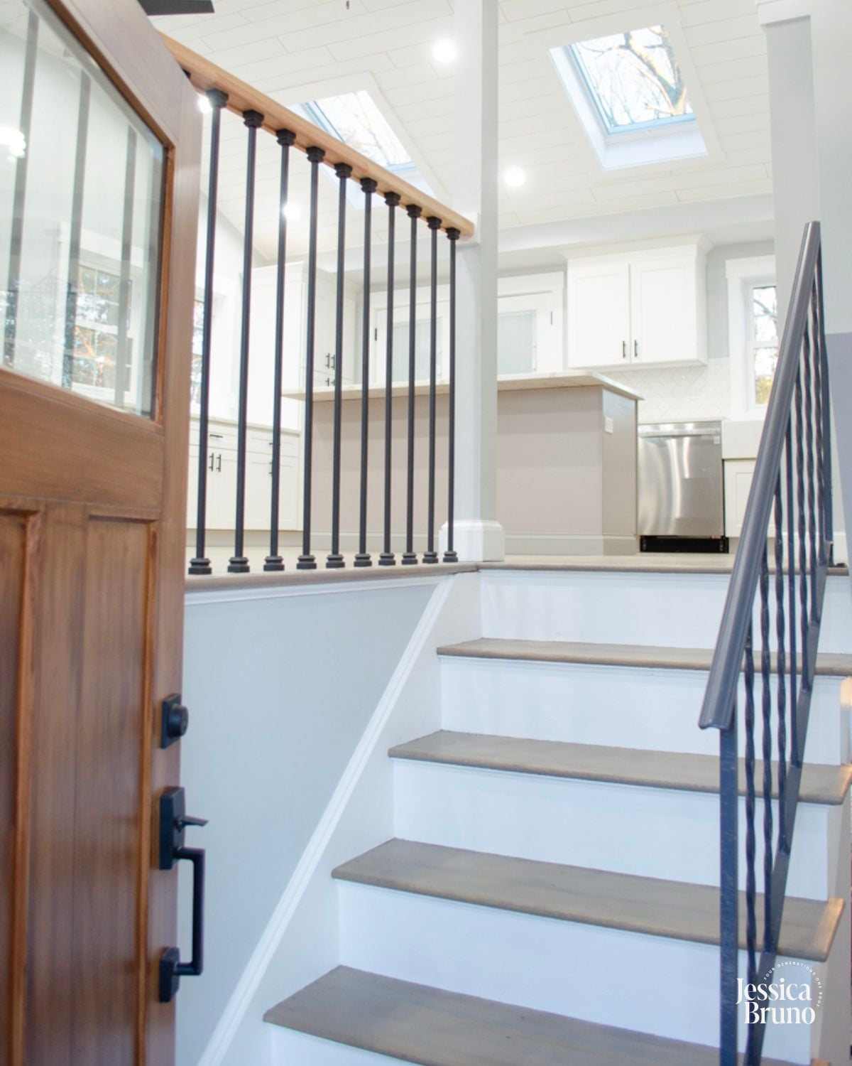 modern split level entryway with open living room