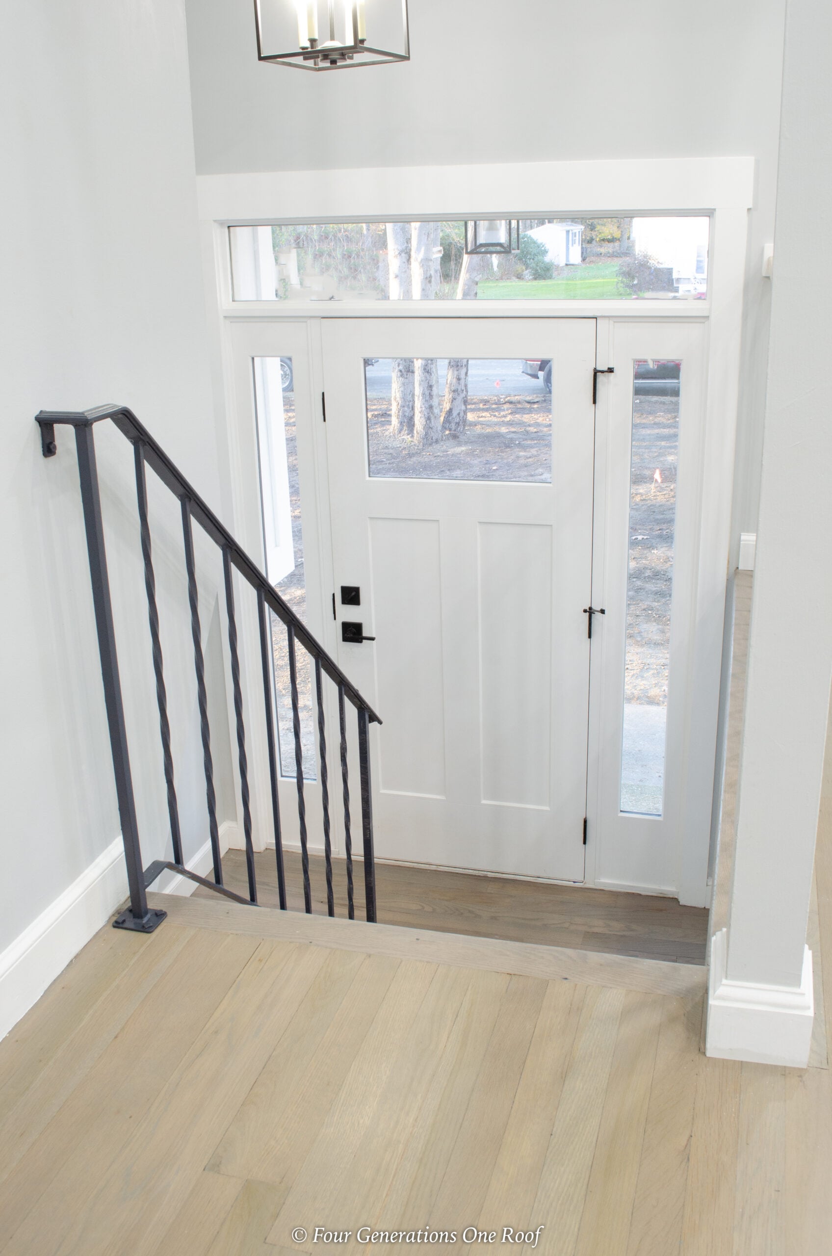modern split level entryway with open living room