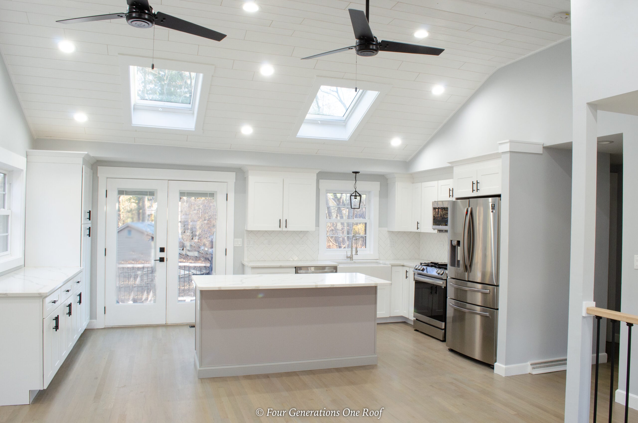 modern split level white kitchen with skylights 