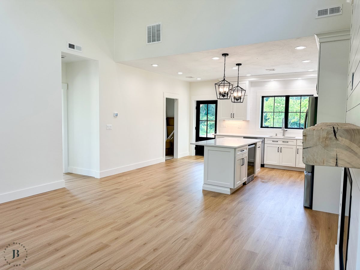 Finished 900 sq ft multigenerational ADU, real small ADU floor plan ideas living room and kitchen with warm oak flooring