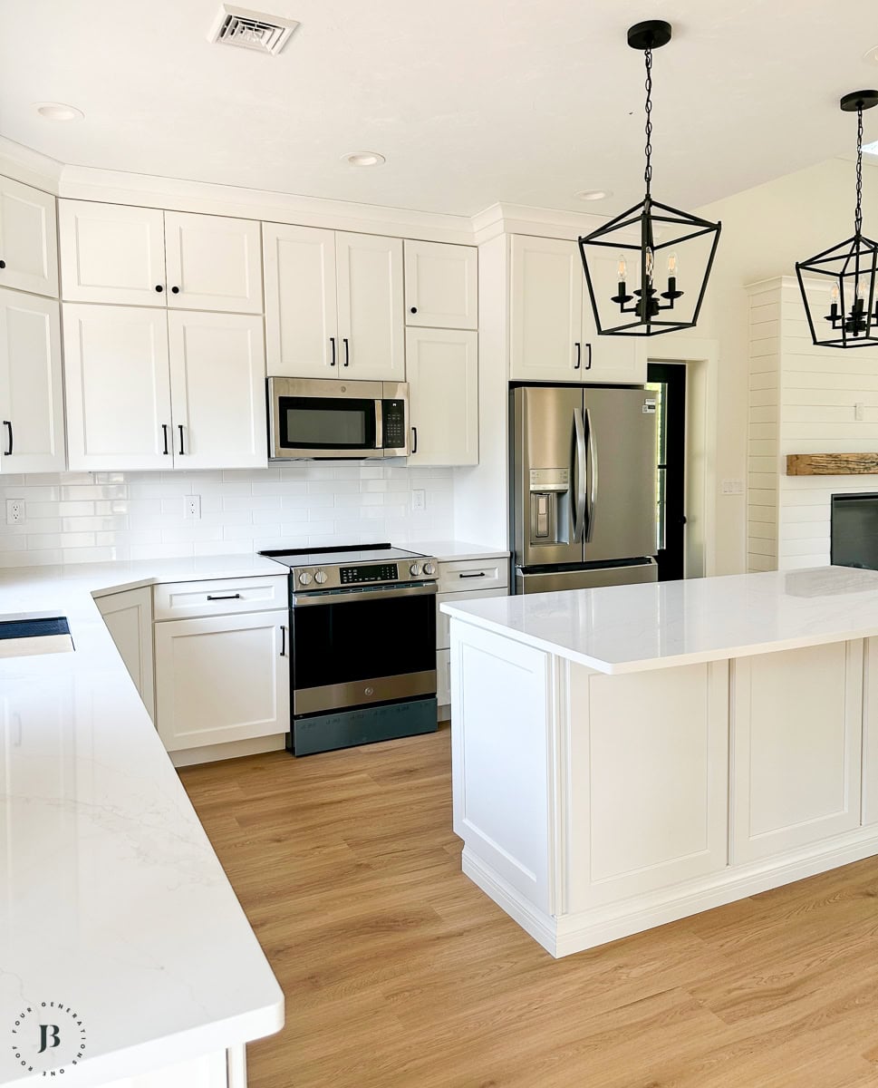 Finished 900 sq ft multigenerational ADU, real small ADU floor plan ideas with white kitchen cabinets and large island for gathering