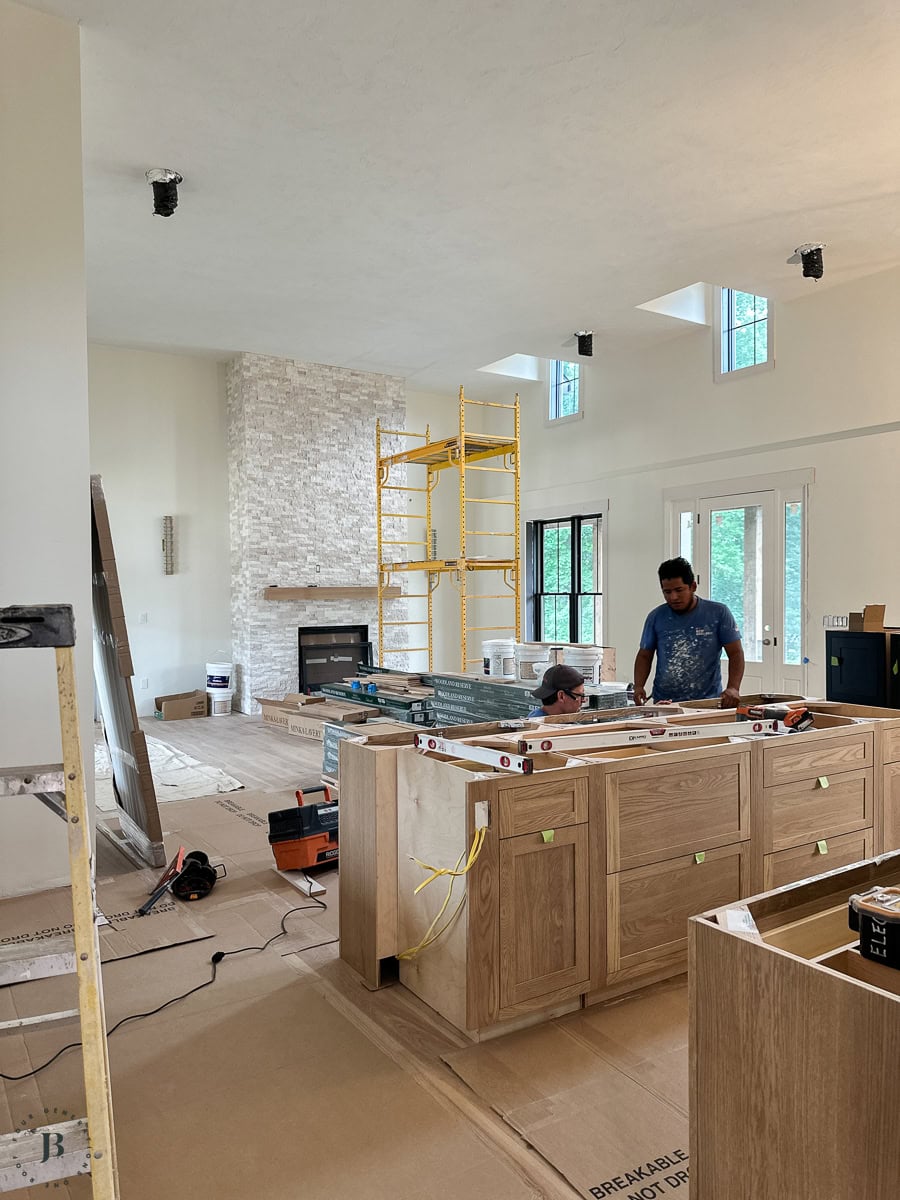 open kitchen and living area with a vaulted ceiling inside the ICF main house
