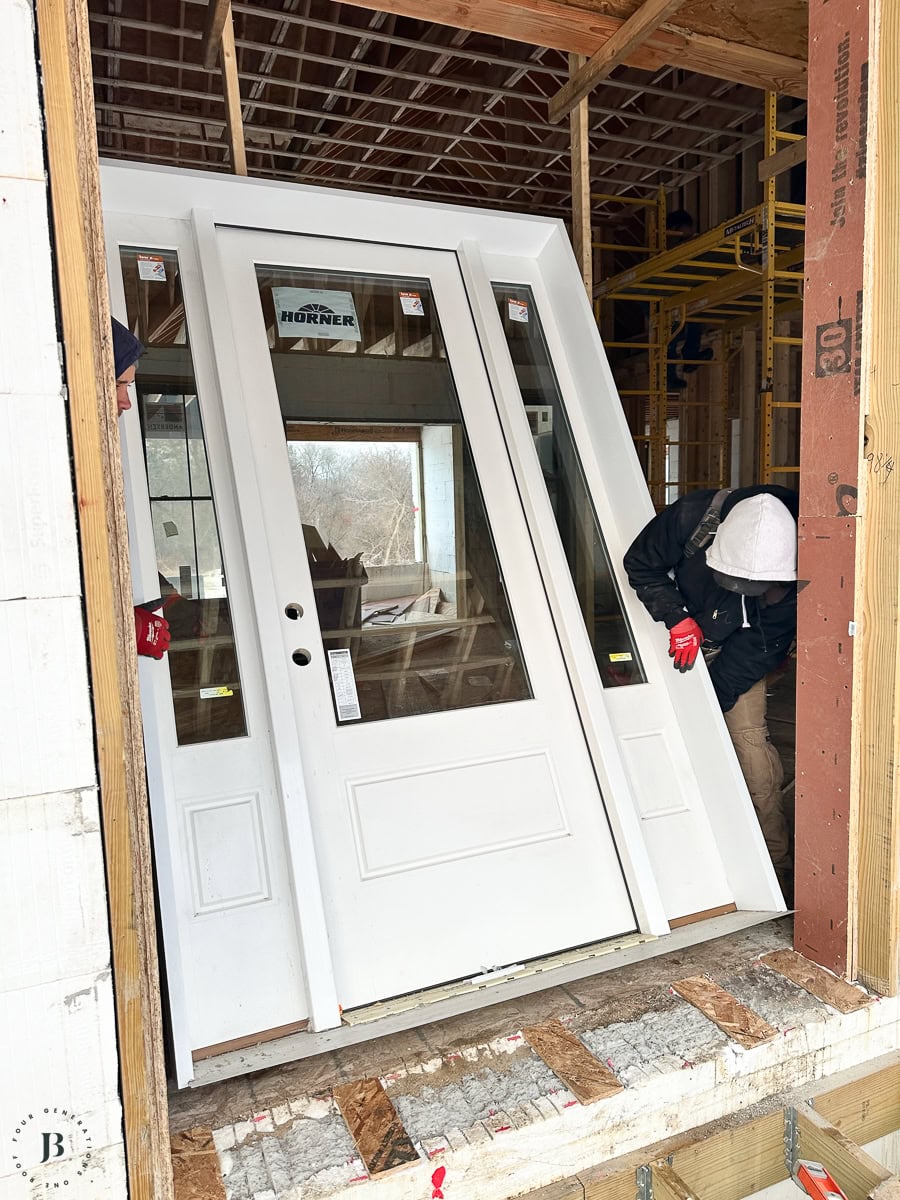 custom Horner Millwork front door leading to the covered front porch