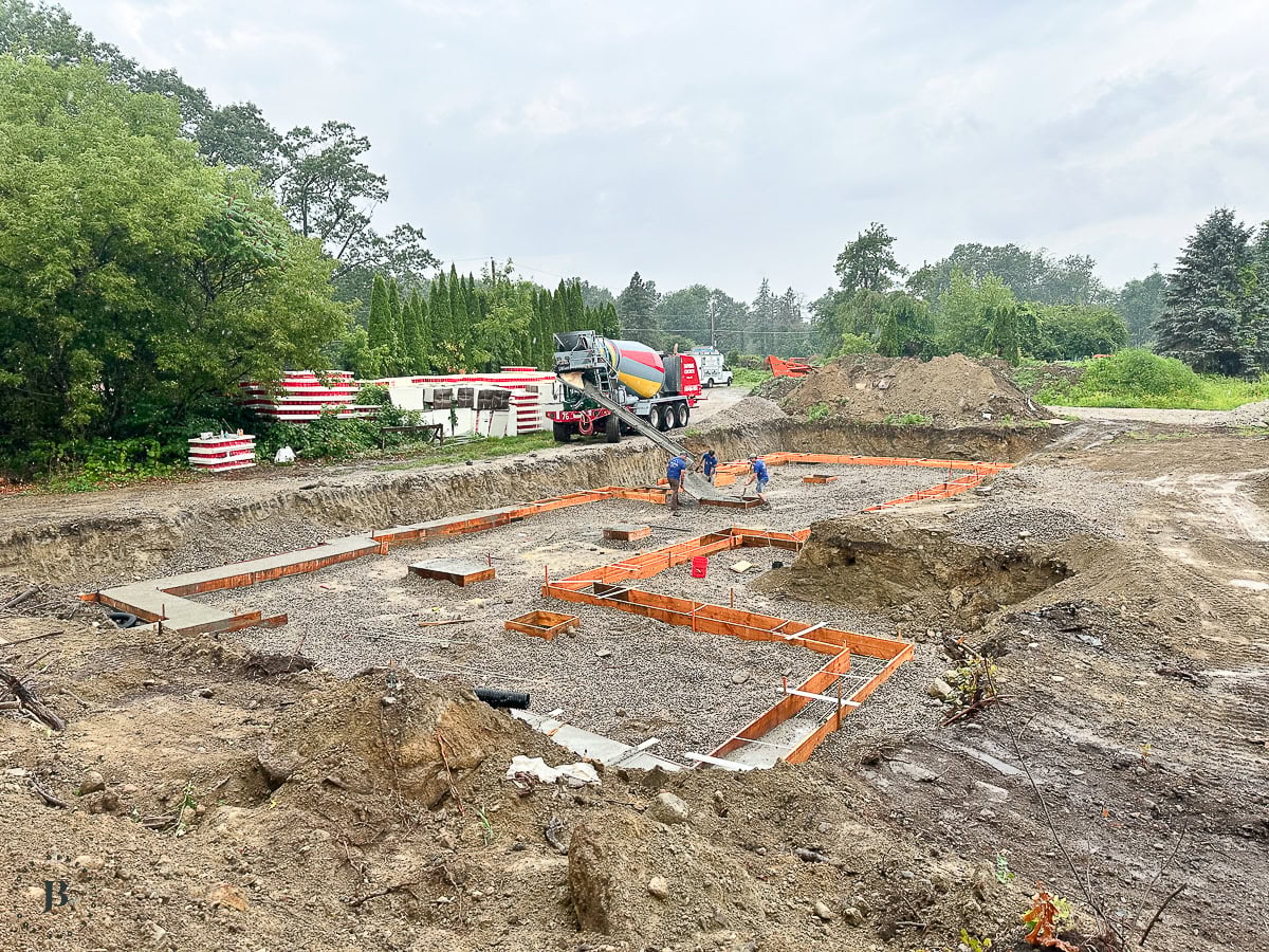 concrete truck pouring footings for the ICF main house foundation