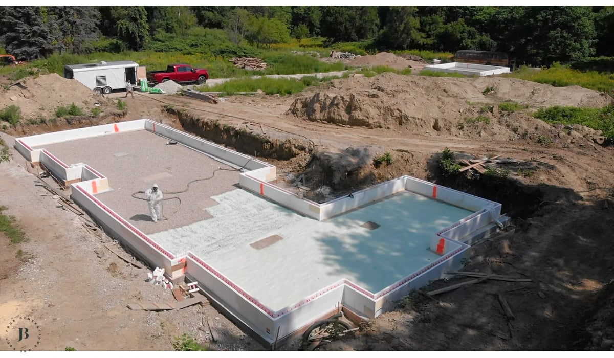 aerial drone footage of a two houses on one property being built from the ground up