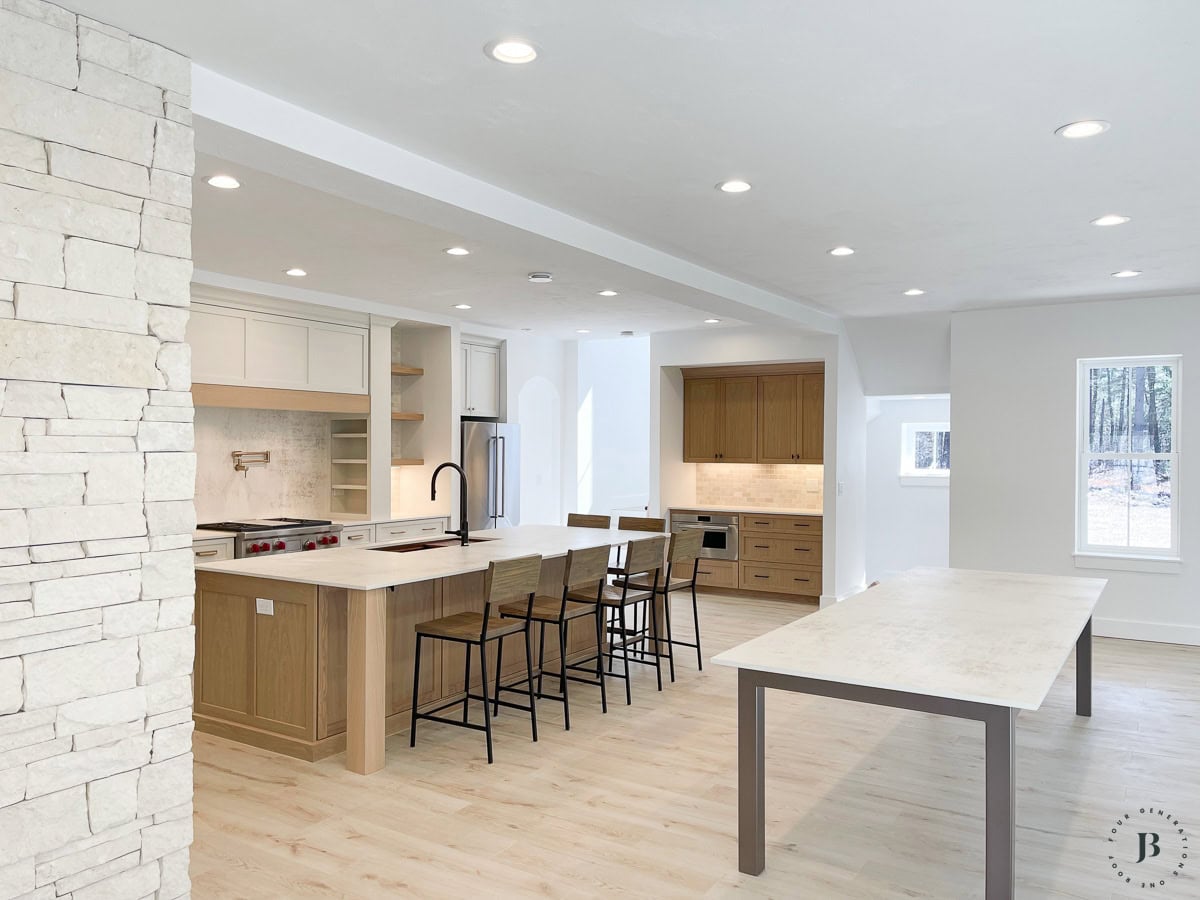 kitchen layout with white oak cabinets and large island