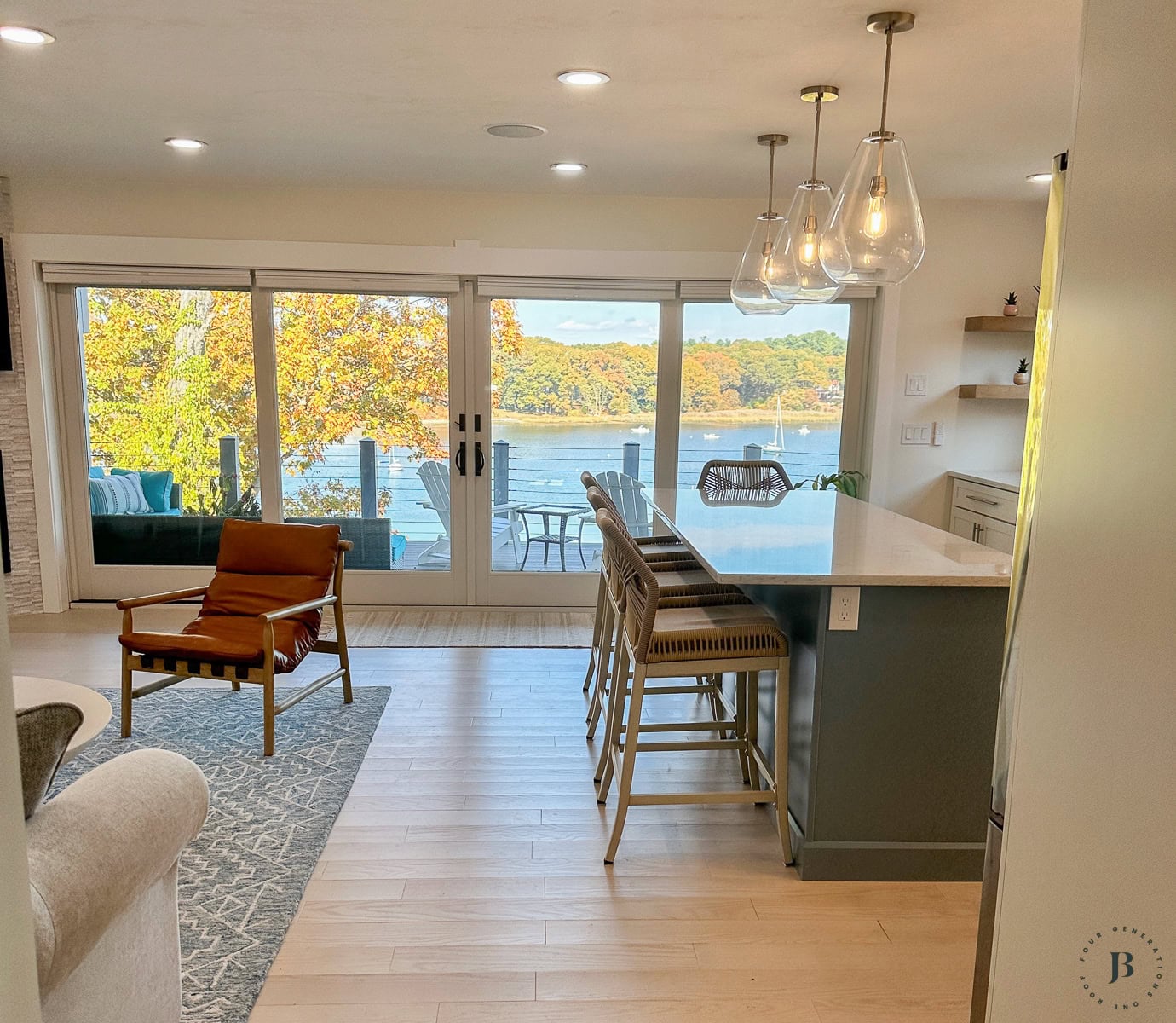 narrow kitchen with waterview and an island 